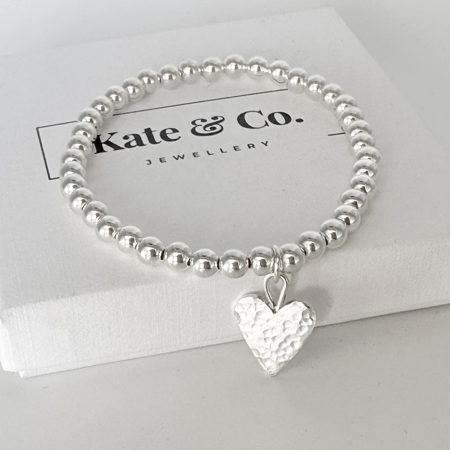 Silver Stretch Bead Bracelet with Hammered Heart Charm