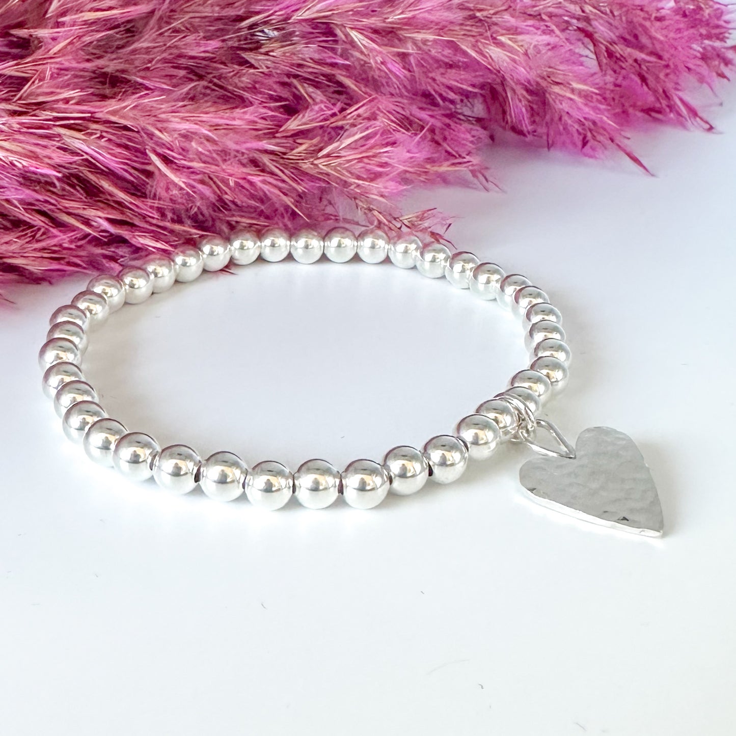 Silver Stretch Bead Bracelet with Hammered Heart Charm